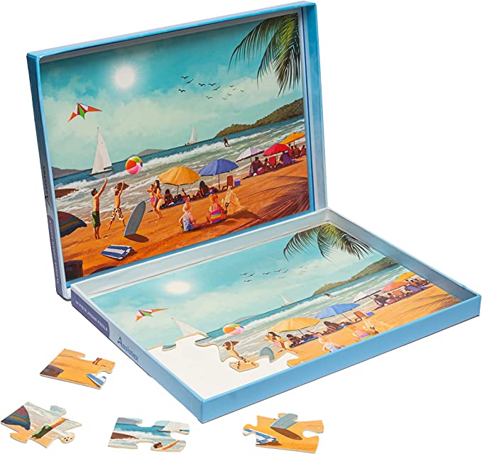 Beach-scene jigsaw puzzle partly assembled in its box tray, with loose pieces nearby — Assistex via EOWD Autism Living