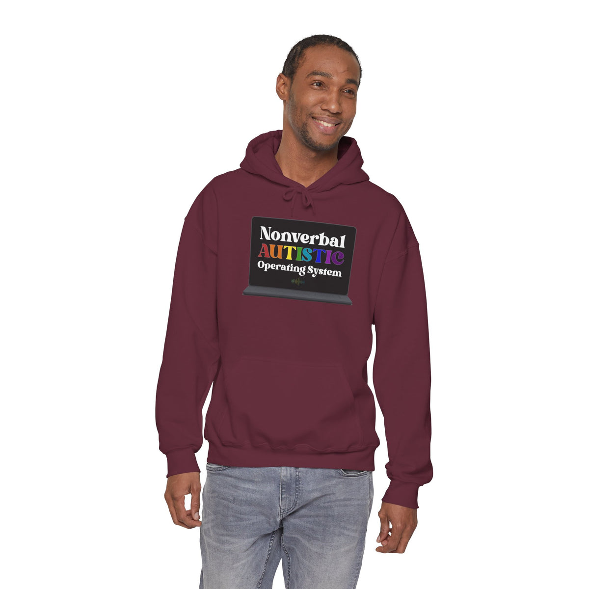 Adult model wearing a maroon pullover hoodie with the bold rainbow “Nonverbal AUTISTIC Operating System” laptop graphic, front view — EOWD Autism Living