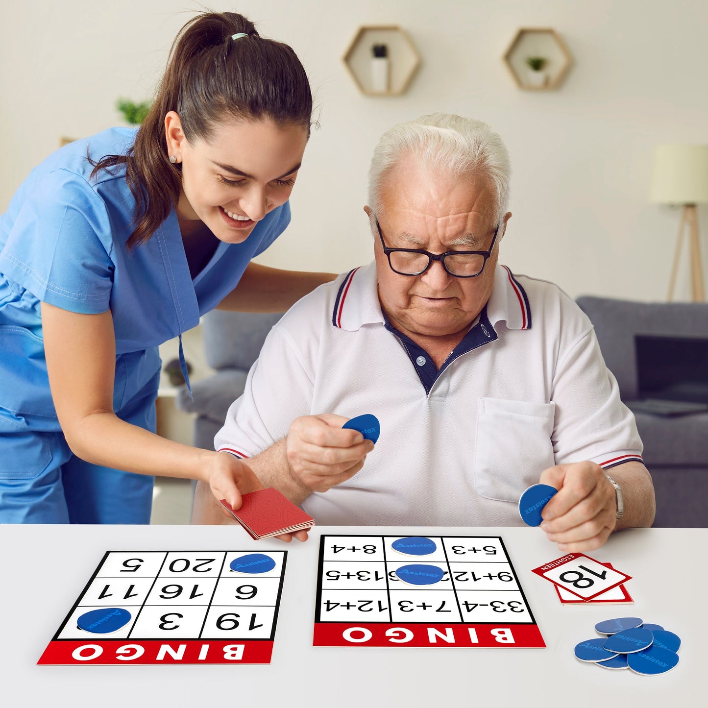 Caregiver and older adult playing bingo together at a table — Assistex via EOWD Autism Living