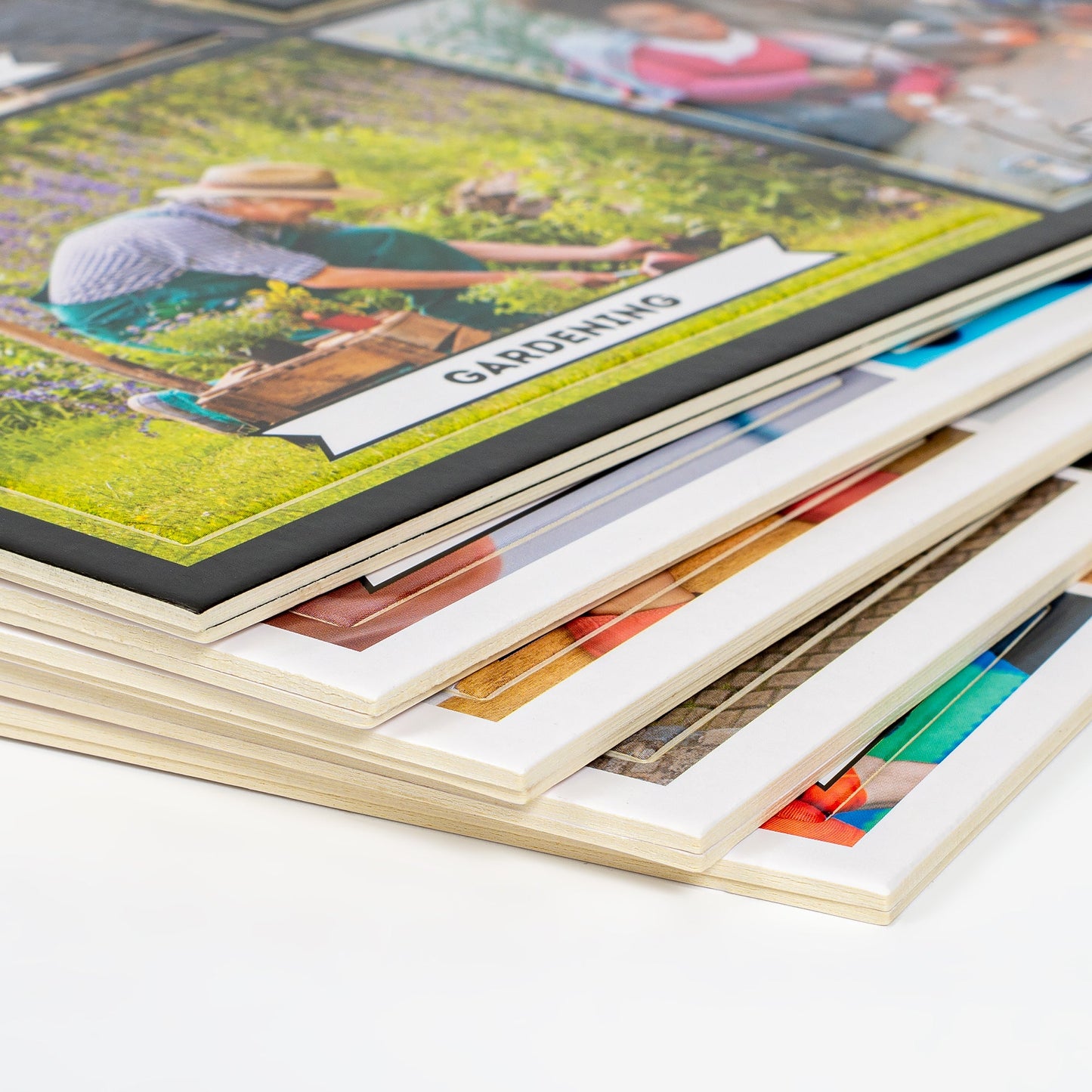 Care Close-up of scattered photo activity cards and game pages from the Assistex matching game set — Assistex via EOWD Autism Living