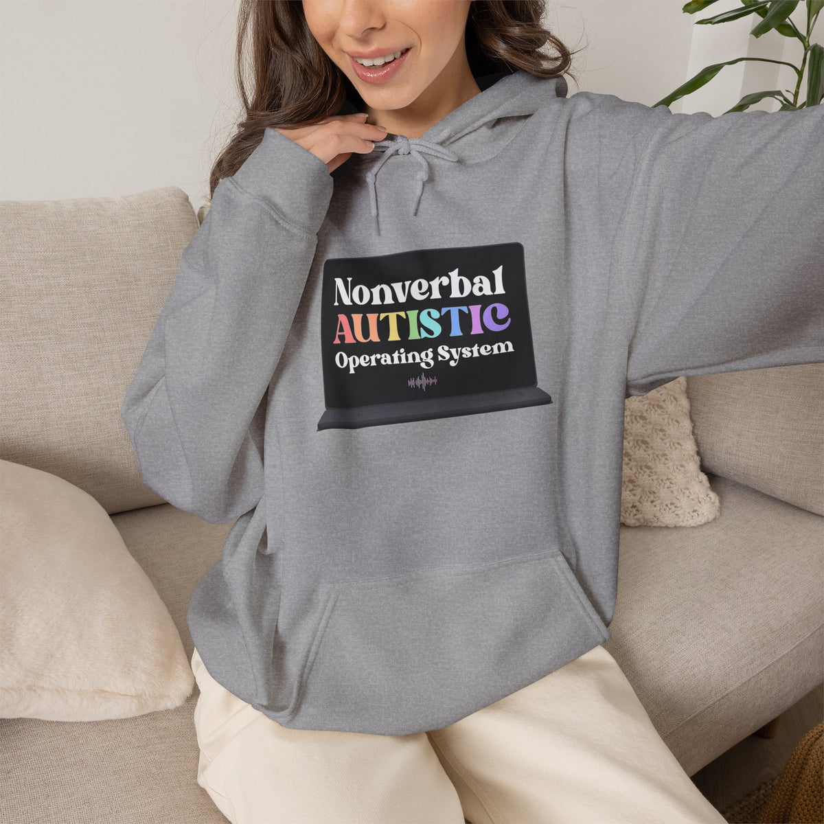 Person wearing a sport grey pullover hoodie with a small rectangular graphic centered on the chest — EOWD Autism Living