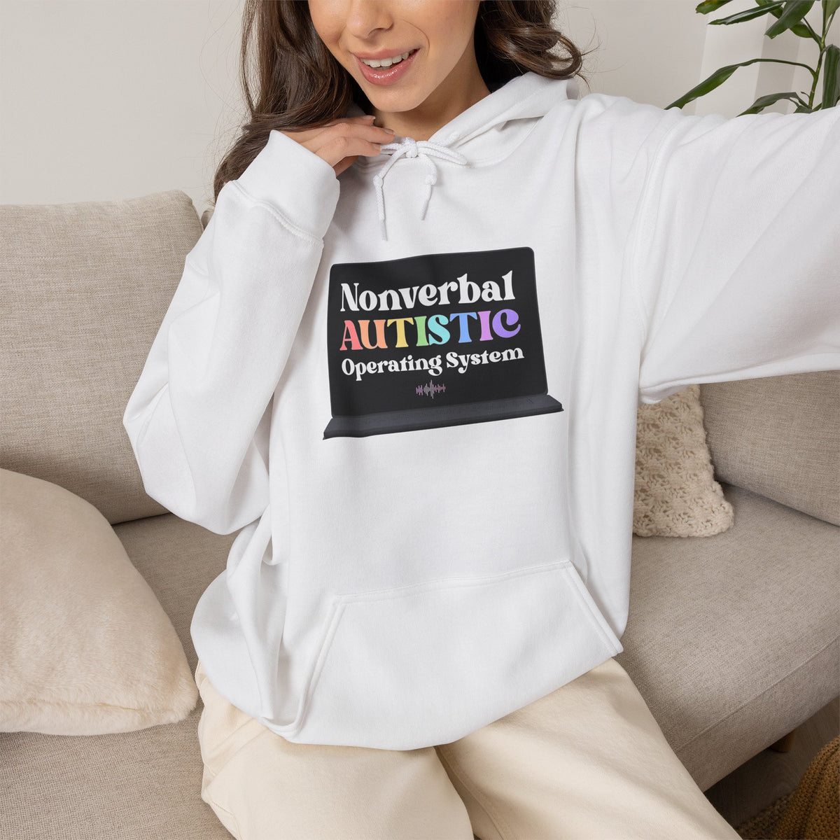 Person wearing a white pullover hoodie with a small rectangular graphic centered on the chest — EOWD Autism Living