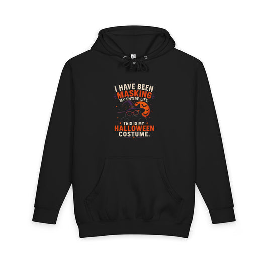 Front of a black hoodie with white and orange masking-themed wording, a cat in a purple witch hat and orange sunglasses, an orange moon, and bats — EOWD Autism Living