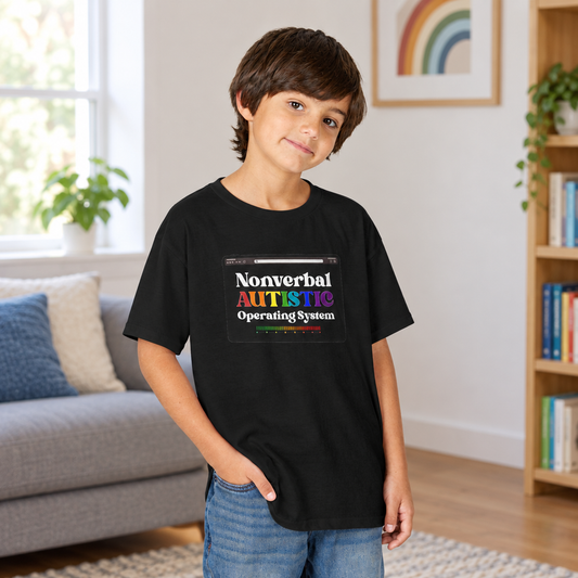 Young person wearing a black youth T-shirt with a rainbow-accented tablet-style graphic reading “Nonverbal AUTISTIC Operating System” in a naturally lit room — EOWD Autism Living