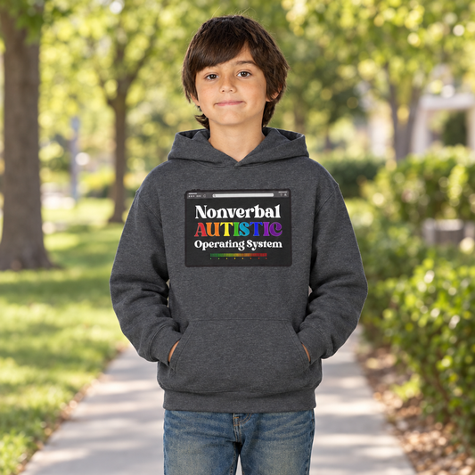 Front view of a young person wearing the Dark Heather youth hoodie with the colorful “Nonverbal AUTISTIC Operating System” graphic on a park walkway — EOWD Autism Living
