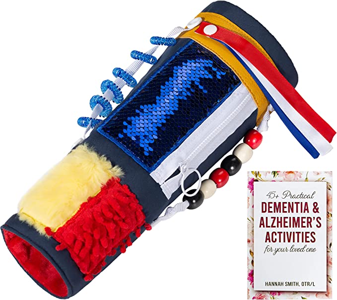 Dark blue activity sleeve with blue sequins, zipper, beads, coiled rings, ribbons, and yellow and red fabric patches beside a guide booklet — Assistex via EOWD Autism Living