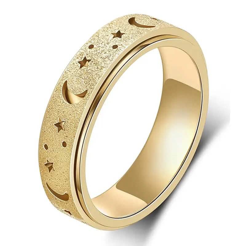 Close-up of gold stainless steel rotatable moon and star fidget ring on white background — moon and star engraving detail visible — DailySale via EOWD Autism Living