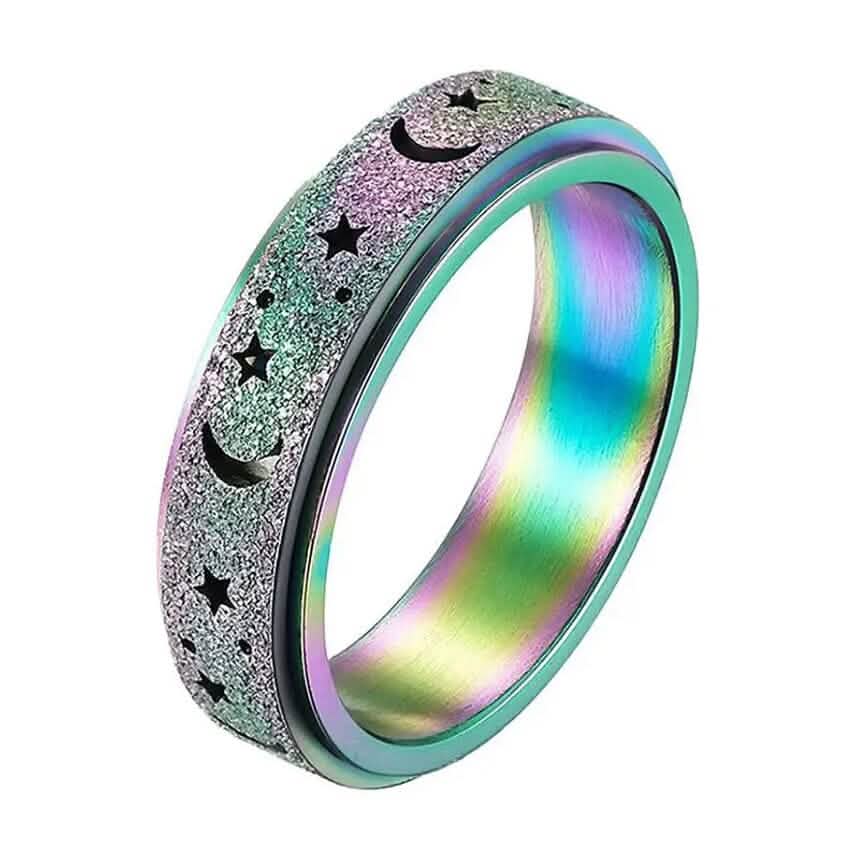 Close-up of multicolor rainbow stainless steel rotatable moon and star fidget ring on white background — spinner band detail visible — DailySale via EOWD Autism Living