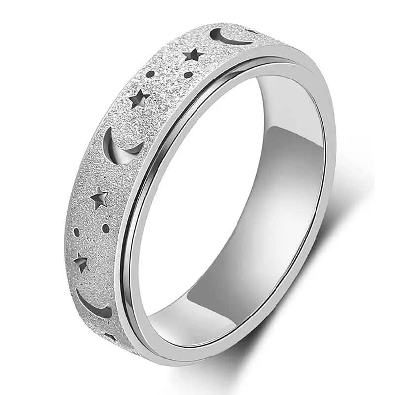 Close-up of silver stainless steel rotatable moon and star fidget ring on white background — moon and star engraving detail visible — DailySale via EOWD Autism Living