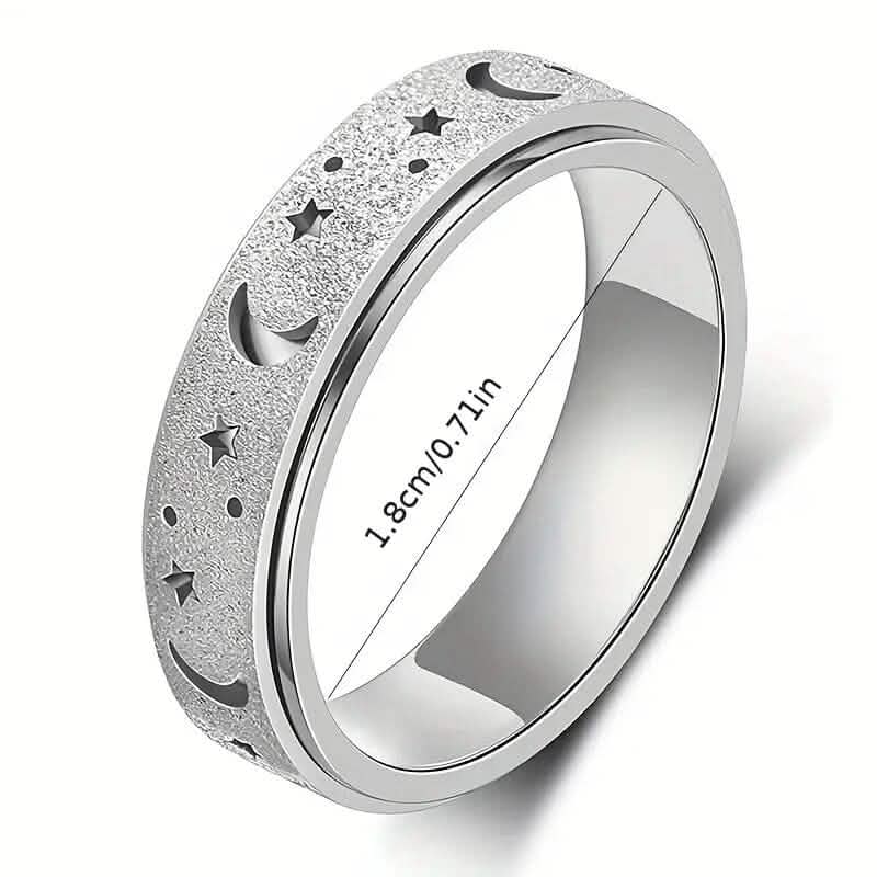 Silver stainless steel rotatable moon and star fidget ring on white background with measurement annotation showing band width — DailySale via EOWD Autism Living