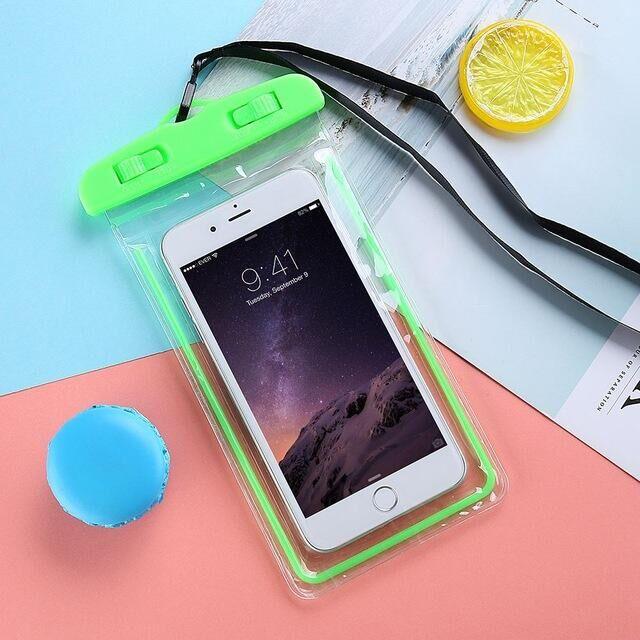 STEVVEX waterproof phone pouch with strap in green shown with phone inside on pink background — STEVVEX Gadgets via EOWD Autism Living