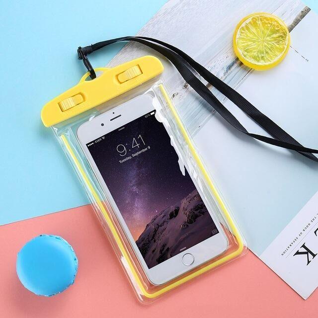 STEVVEX waterproof phone pouch with strap in yellow shown with phone inside on pink background — STEVVEX Gadgets via EOWD Autism Living